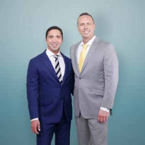 Photo of Florida Probate Law Firm attorneys Michael and Tommy standing together in a professional setting, showcasing their expertise in probate law.